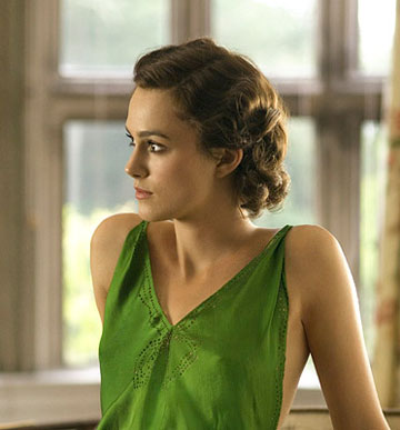  Keira Knightley, barely wrapped in a drapey green dress, is entwined 